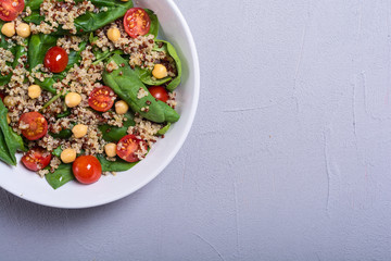 Spinach salad with quinoa , tomatoes and chickpea