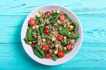 Spinach salad with quinoa , tomatoes and chickpea