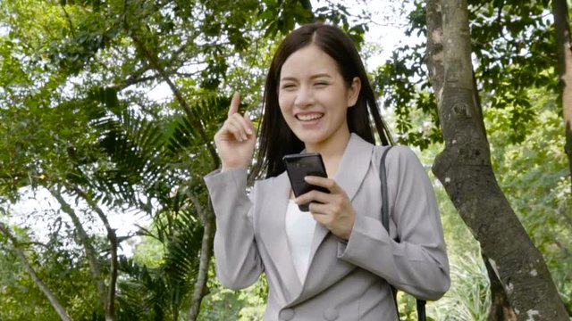businesswoman looking on mobile smartphone. In slow motion shot.