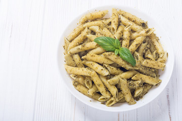 Italian penne pasta with sauce pesto