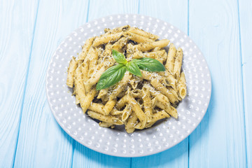 Italian penne pasta with sauce pesto