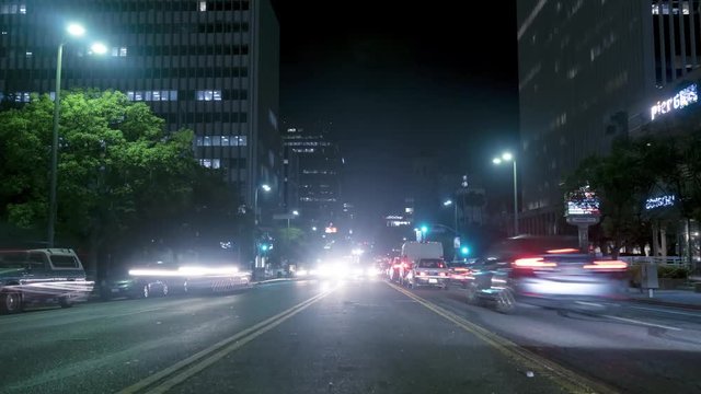 Night city cars traffic time lapse. 4K timelapse of a busy city street and cars driving leaving light trails