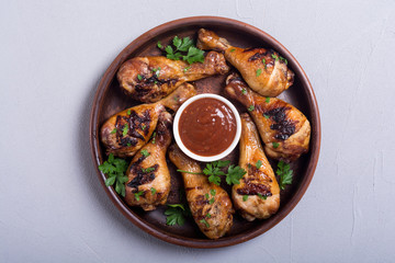 Grilled chicken legs with tomato sauce