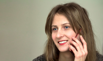 Young pretty girl talking on her mobile phone