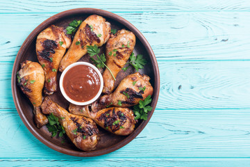 Grilled chicken legs with tomato sauce