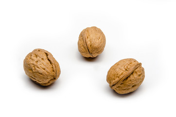 three walnuts on a white background, isolated