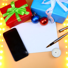 Blank paper, Christmas decorations and gifts. Write Christmas wishes, writing, deeds.