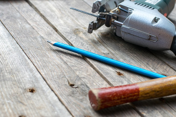 simple worker tools on a wooden table in a workshop