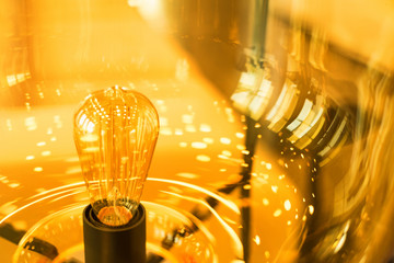 Glowing modern yellow lamp made of glass close
