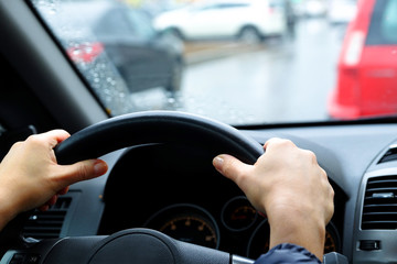 Car control panel. Girl's hands on the steering wheel