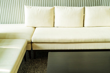 Office waiting area interior with white sofas
