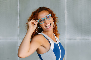 Expressive fun woman laughing. Modern lifestyle success and eyewear fashion concept.