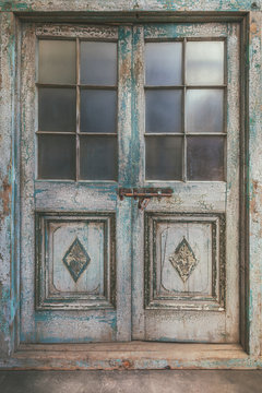 Ancient weathered double entrance door