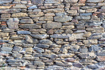 Clean shoot of contrast masonry stone wall made by turkish wall craftsman