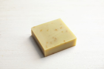 Hand made soap bar on white wooden background