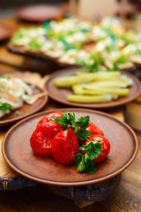 Delicious snacks for beer on a wooden table