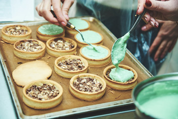 Process of making tart with salted caramel french dessert. Food industry, mass or volume production.