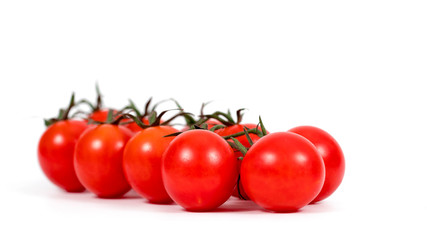 Red cherry tomato isolated on white background