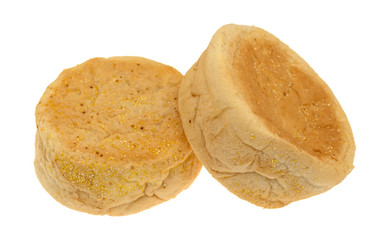 Side view of two large size freshly baked English muffins isolated on a white background.