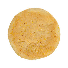 Overhead view of a large size freshly baked English muffin isolated on a white background.