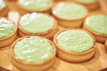 Process of making tart with salted caramel french dessert. Food industry, mass or volume production.