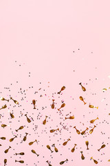 Party confetti background in stylish gold colors. Festive concept.