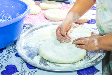 Coocing the traditional Georgian dish kubdari with meat, Svaneti