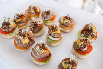 Party catering Cocktail food on a mini dish and tiny glass bowls.