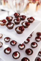 Party catering Cocktail food on a mini dish and tiny glass bowls.