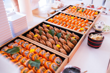 Party catering Cocktail food on a mini dish and tiny glass bowls.