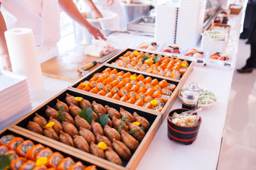 Party catering Cocktail food on a mini dish and tiny glass bowls.