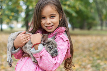 Portrait of a little girl with her dog