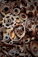 Steampunk background, machine parts, large gears and chains from machines and tractors.