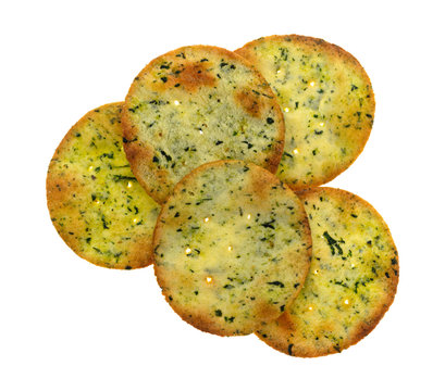 Top View Of A Group Of Garlic And Cheese Flavored Potato Crackers Isolated On A White Background.