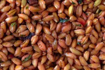 Closeup of cooked farro with beets and spinach.