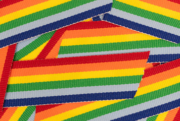 Top close view of snippets of colorful trim cloth.