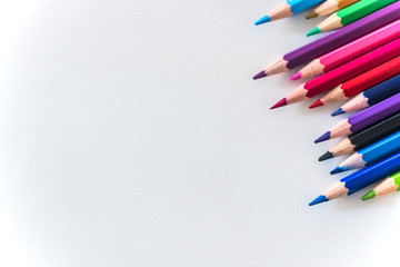 Colored pencils arrangement in an ordinary order, close up, isolated
