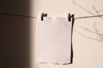 Empty card mockup, ,Wall Art Mockup,Print hanger Mockup. Wall and strong winter shadows in sunligjhts