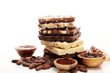 Chocolate bars on table with chocolate tower.