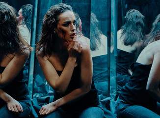 Beautiful girl with a scared face in the blood 