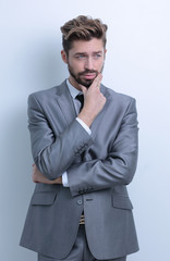 young businessman posing with crossed arms.