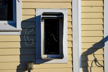 payphone on wood wall 