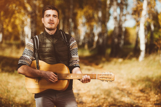 playing the guitar in nature