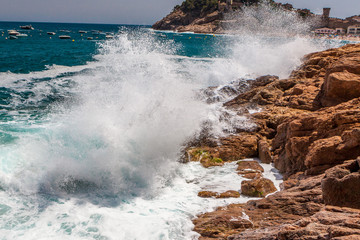 Rocks, waves and surf on the coastline shores and beach