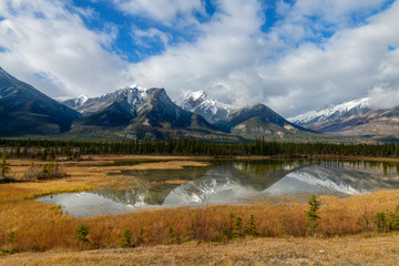 Esplanade Mountain, Whitecap Mountain and the Gargoyle Mountain reflecting in the Athabasca River in Jasper National Park