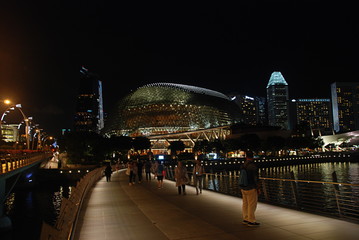 Modern architecture around Marina Bay in Singapore city centre illuminated at night