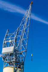 image of a part of a crane with a blue sky background