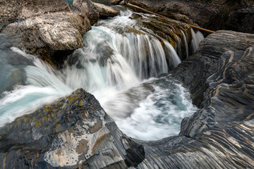 Natural Bridge and sinkhole rock formation over Kicking Horse River in Yoho National Park, British Columbia, Canada