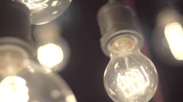 Retro light bulb with unusual spiral. Edison lamps in loft style.