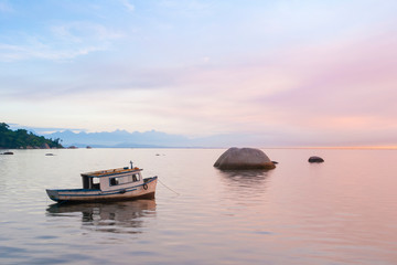Fototapeta na wymiar Landscape with fisherman boat at sunrise